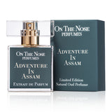 Front view of Adventure In Assam 15 ml perfume bottle with its box